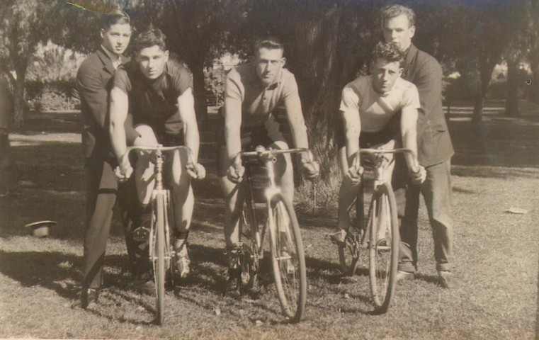 Caption: a group of people on bicycles (0.58 confidence)<br />Labels: outdoor, person, posing, bicycle, group, people, old, vintage